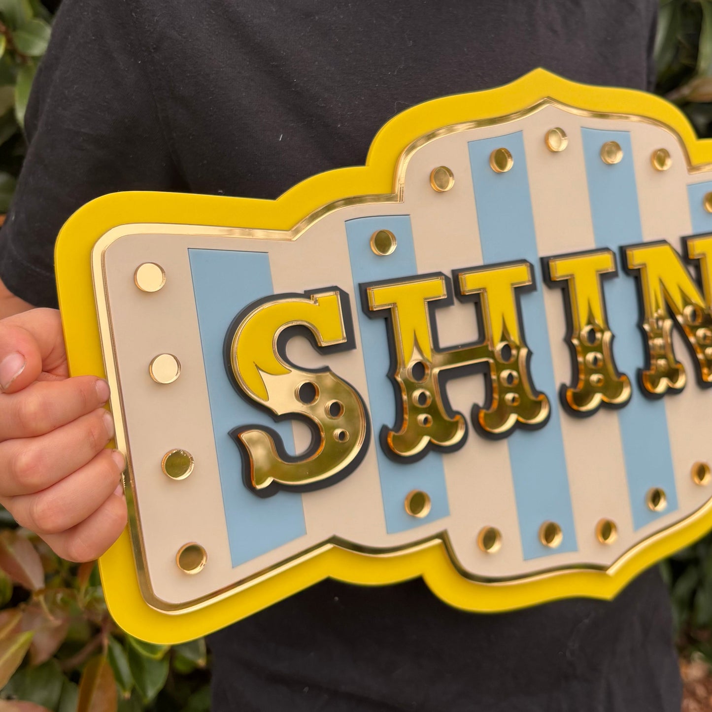 Shine layered acrylic wall sign in bright yellow with mirror gold details, whimsical statement wall decor for colourful homes, reading nooks and creative spaces.