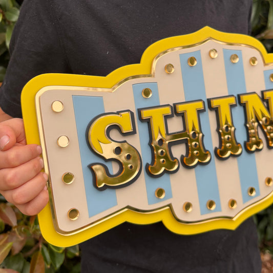 Shine layered acrylic wall sign in bright yellow with mirror gold details, whimsical statement wall decor for colourful homes, reading nooks and creative spaces.